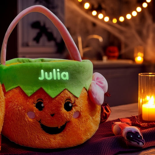 Glow in the dark personalized trick or treat basket with cute pumpkin face and name Julia