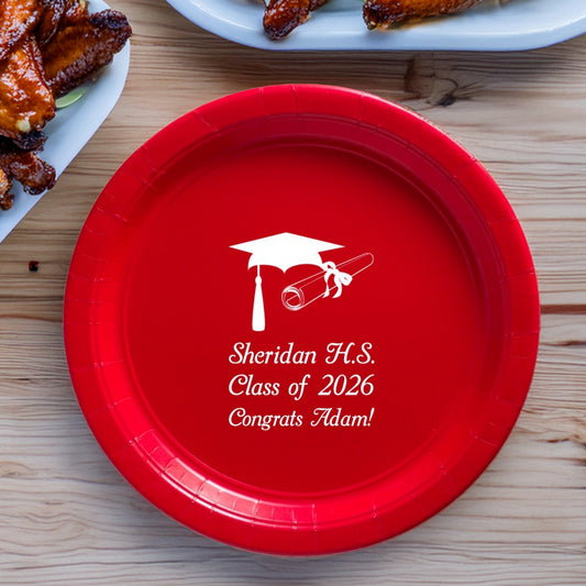 Red paper plated personalized with graduation cap and diploma clip art and text "[School Name], Class of 2026, Congrats [Graduate Name" in white print