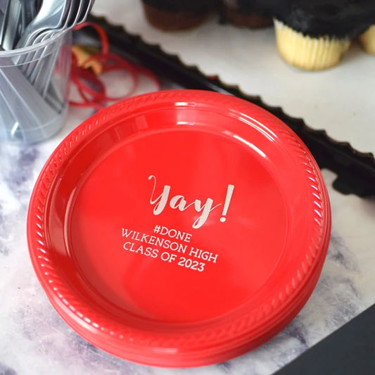 Red plastic grad party dessert plates personalized with yay! design and custom text in silver print
