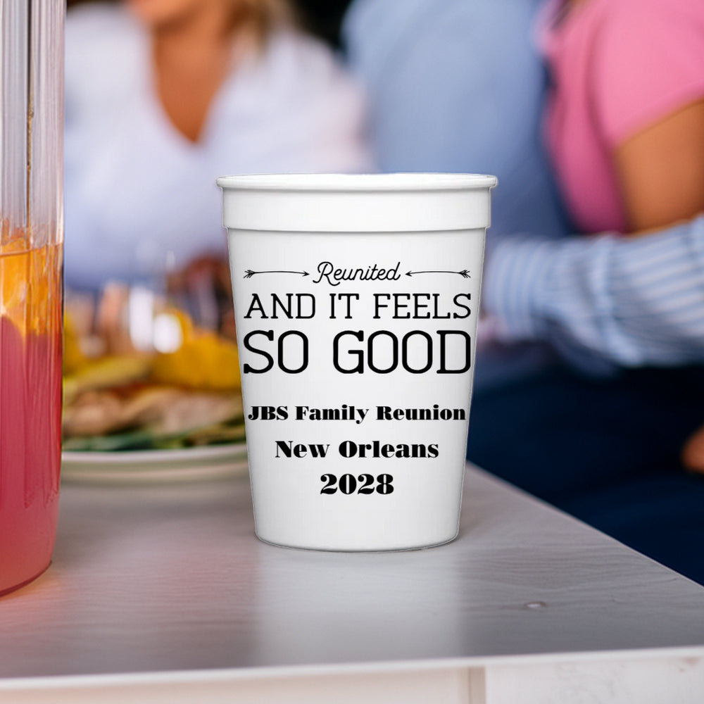 A white 12 oz plastic cup personalized with "Feels So Good" family reunion graphic and text "JBS Family Reunion, New Orleans, 2028" in black print