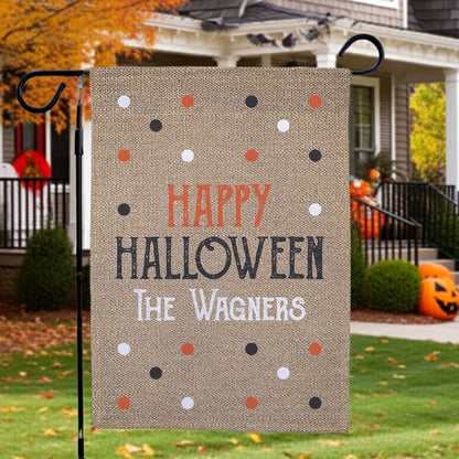 Burlap style Halloween garden flag reading Happy Halloween and The Wagners with orange black white polka dots