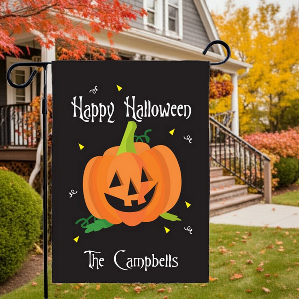Black Halloween garden flag personalized with smiling jack o lantern and The Campbells