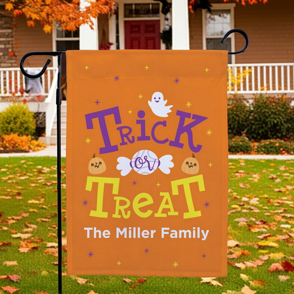Halloween garden flag personalized with orange Trick or Treat design with ghost pumpkins candy and Miller Family name