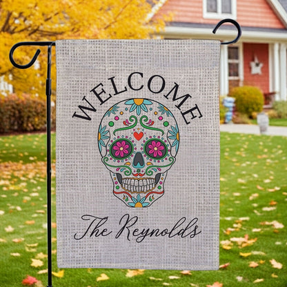 Halloween garden flag featuring colorful sugar skull welcome design with personalized The Reynolds text on burlap