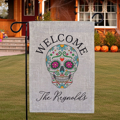 Halloween garden flag featuring colorful Day of the Dead sugar skull welcome and personalized The Reynolds