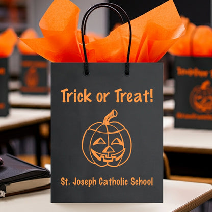 Tippytoad Halloween gift bags with a pumpkin design and 'Trick or Treat' text for festive celebrations