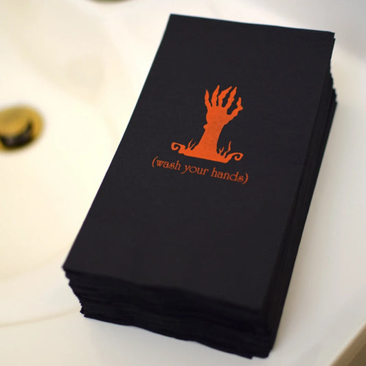 Tippytoad Halloween guest towel napkins black stacked with orange zombie hand graphic and wash your hands text