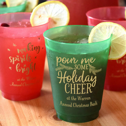 Red and Green frosted Christmas cocktail cups personalized with holiday cheer  and making spirrits bright designs and custom text in gold print