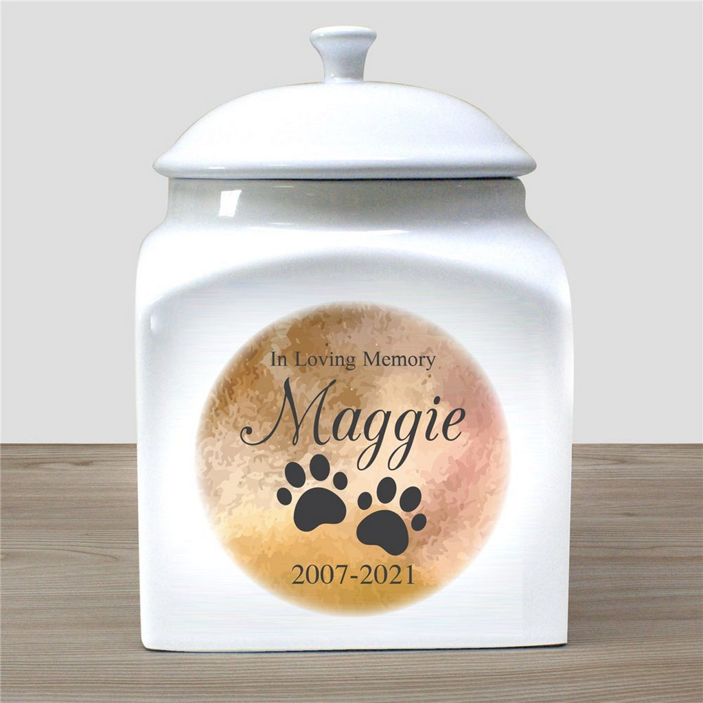 In loving memory personalized white ceramic pet urn with paw prints and name Maggie