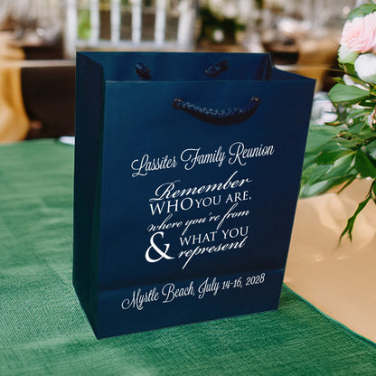 Personalized family reunion welcome gift bags in navy blue with white text and rope handles
