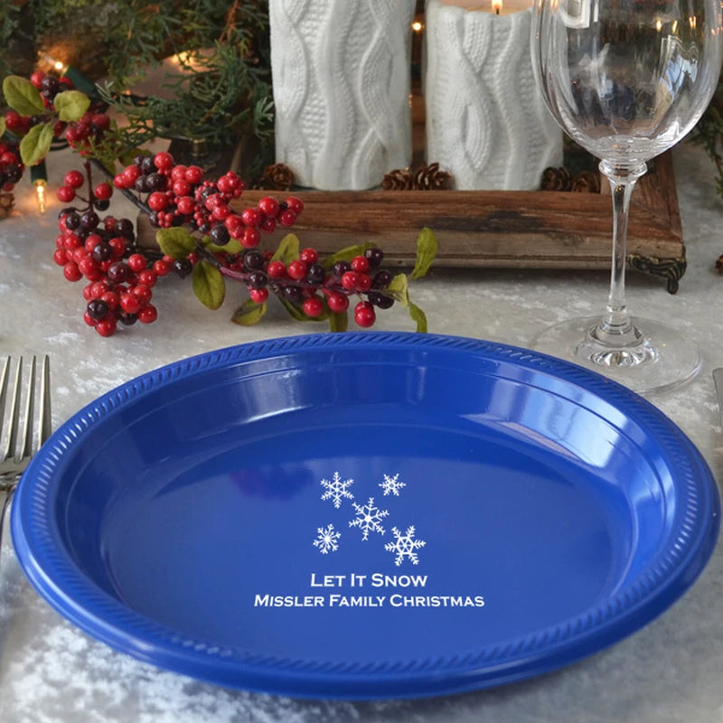 Blue plastic Christmas dinner plate personalized with winter snowflakes design and custom message in white print