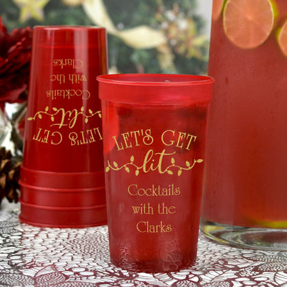 Translucent red 22 oz stadium cups personalized for Christmas with lets get lit design and 3 lines of text in gold print