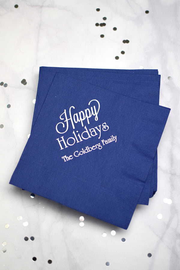 Blue 3-ply paper luncheon napkins personalized with happy holidays design and family name in white imprint color