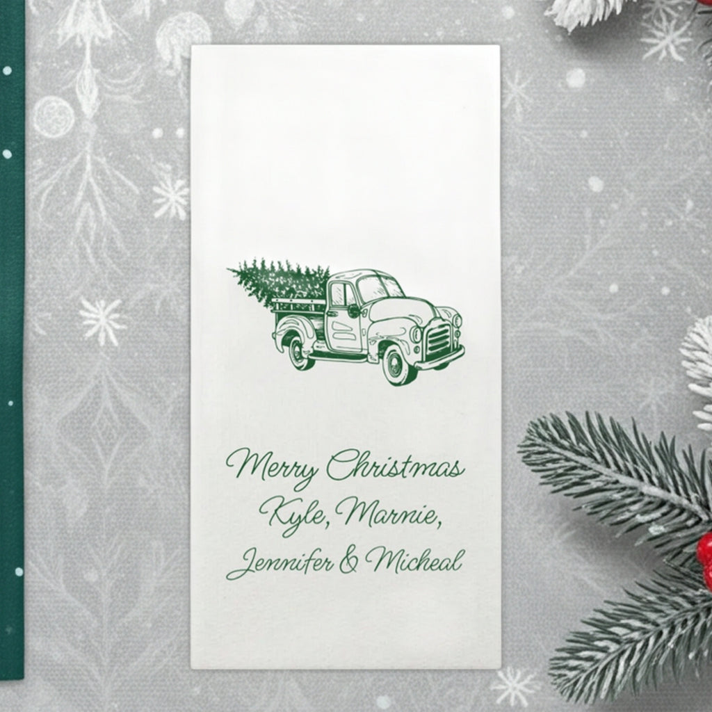 Luxury linen feel Christmas dinner napkins personalized with a festive Christmas truck with tree design and personalized names