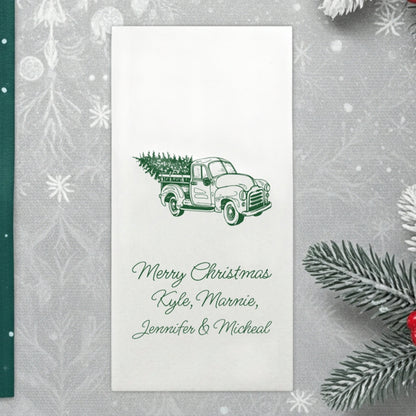 Luxury linen feel Christmas dinner napkins personalized with a festive Christmas truck with tree design and personalized names