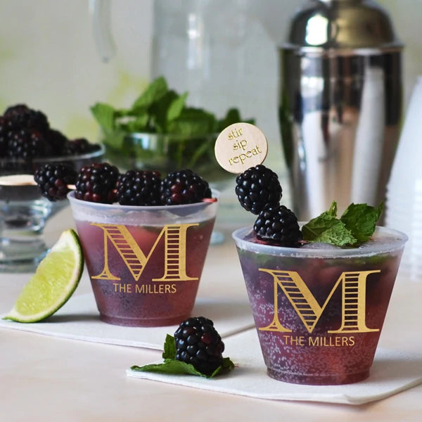 9 oz frosted mixed drink cups personalized for wedding with monogram initial and married couple name in gold print