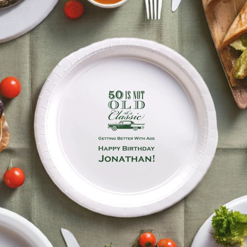 White paper birthday plate personalized with 50th Is Not Old design and custom text in hunter green print.