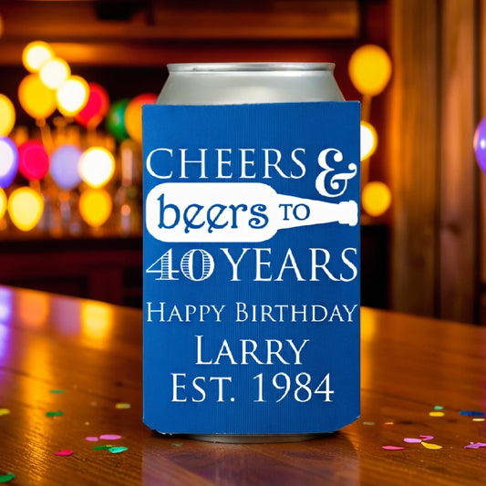 Cerulean blue adult birthday can cooler personalized with cheers and beers to 40 years design and 3 lines of custom text in white print on table with party balloon lights in background