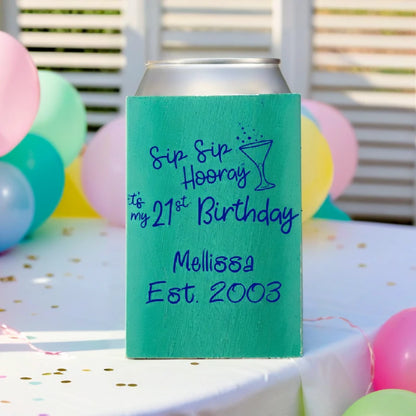 Emerald color insulated birthday can cooler personalized with sip sip hooray 21st birthday design and 2 lines of custom text in reflex blue print on birthday party table