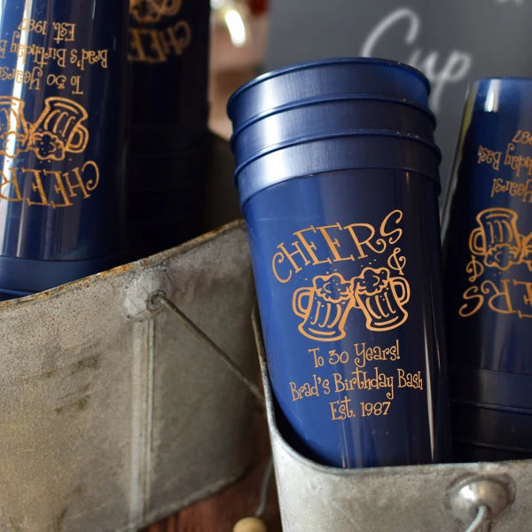 Navy color 22 oz. adult birthday stadium cups personalized with cheers & beers design and 3 lines of custom text in copper print for 30th birthday