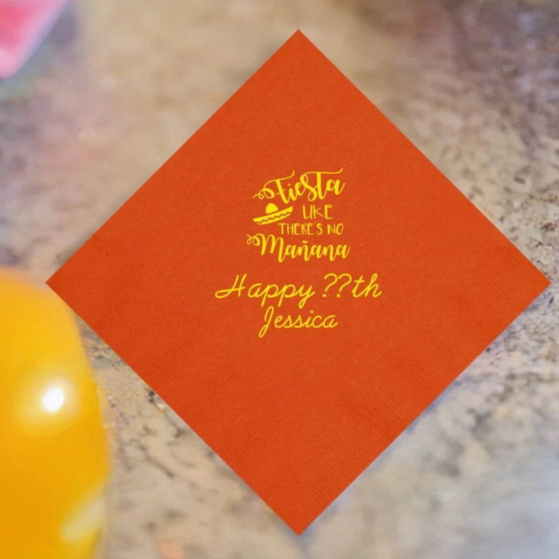 Orange adult birthday dinner napkin personalized with fiesta manana design and custom text in yellow print