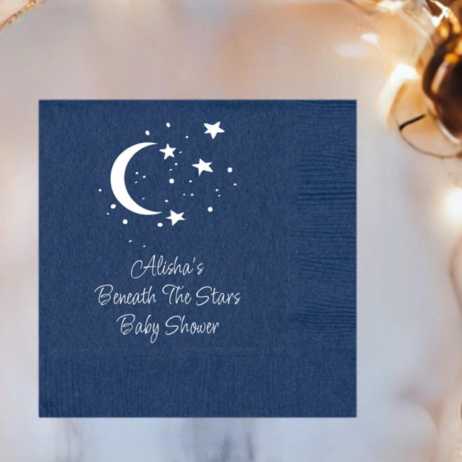 Navy color baby shower cocktail napkin custom printed with moon and stars design and 3 lines of text in white print in square orientation