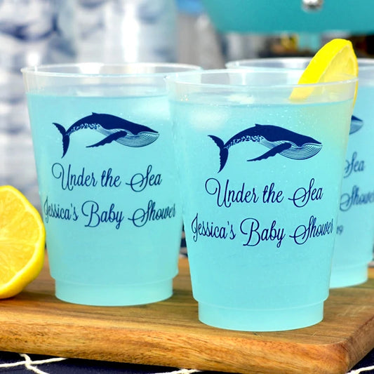 Clear frosted 16 oz. baby shower cups personalized with whale design and 3 lines of text reflex blue print for under the sea theme