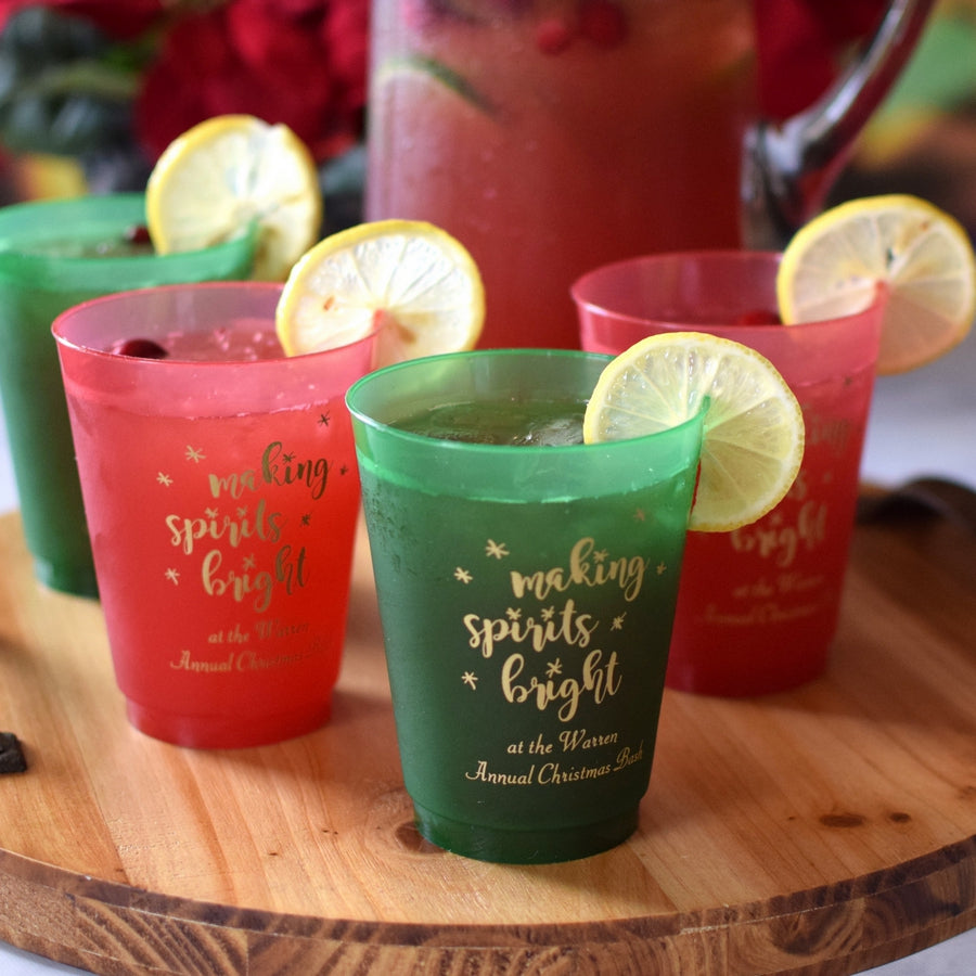 https://tippytoad.com/cdn/shop/files/personalized-christmas-cocktail-cups-16-oz-translucent-red-green-making-spirits-bright.jpg?v=1701466228&width=1445
