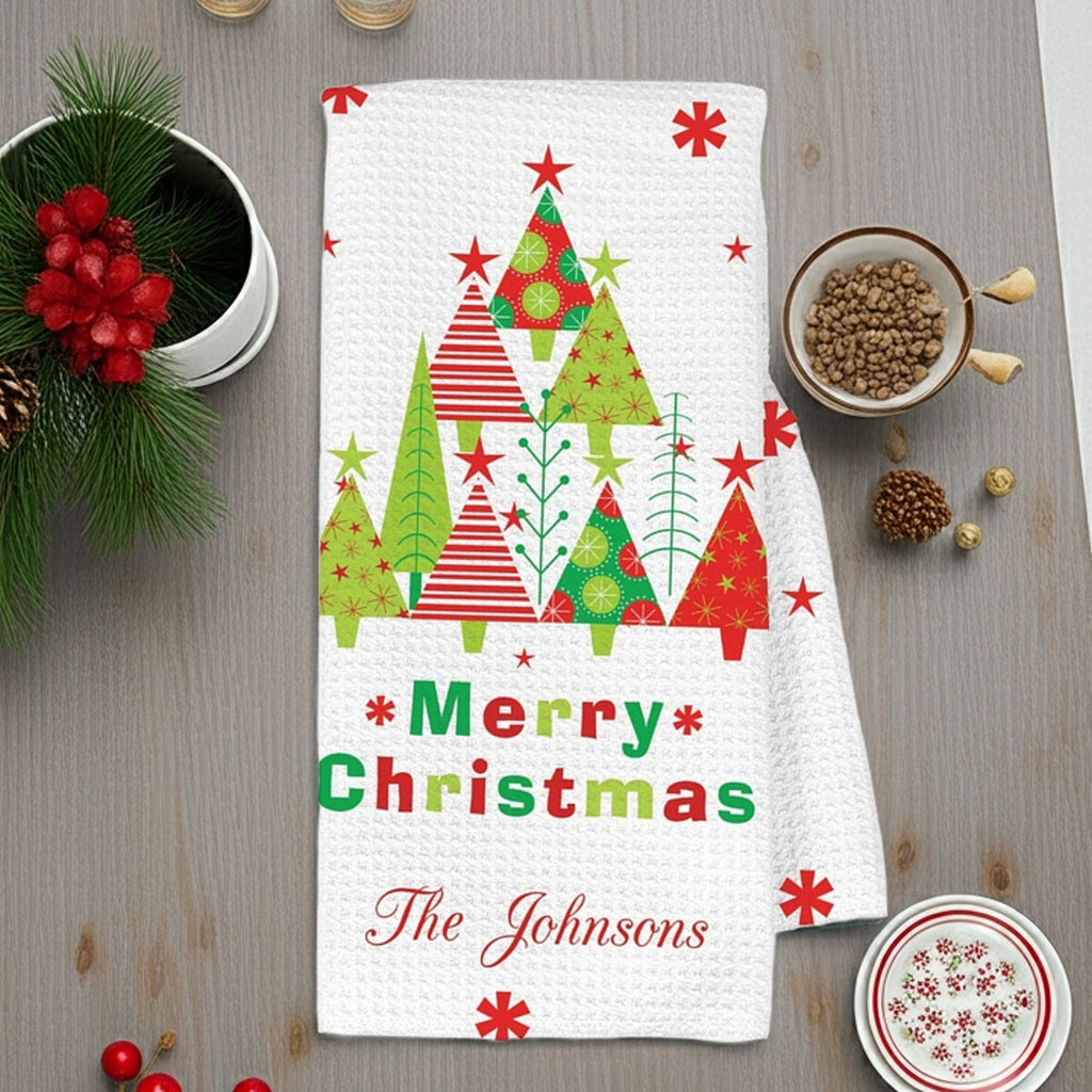 Christmas kitchen towel featuring festive retro Christmas trees and the personalized name The Johnsons