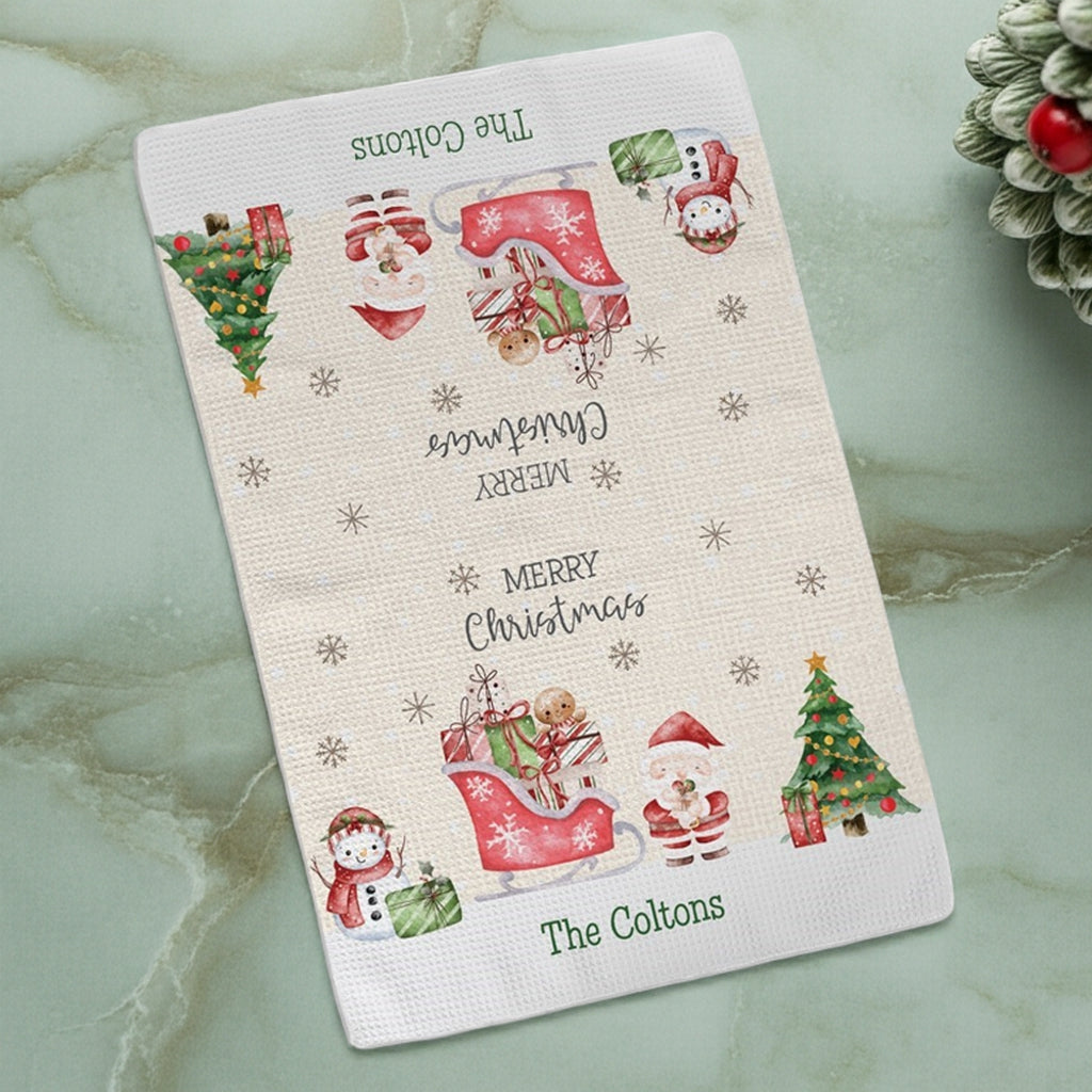 Personalized Christmas kitchen towel featuring festive holiday designs and family name