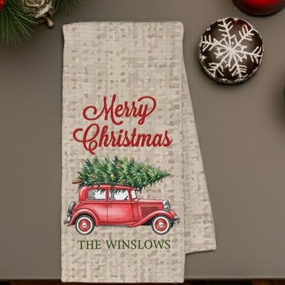 Personalized Christmas kitchen towel featuring a vintage red car with a Christmas tree and Merry Christmas design