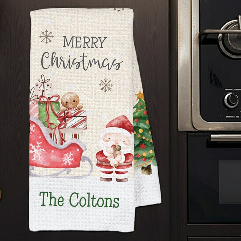 Christmas kitchen towel with santa sleigh and snowman designs and personalized name