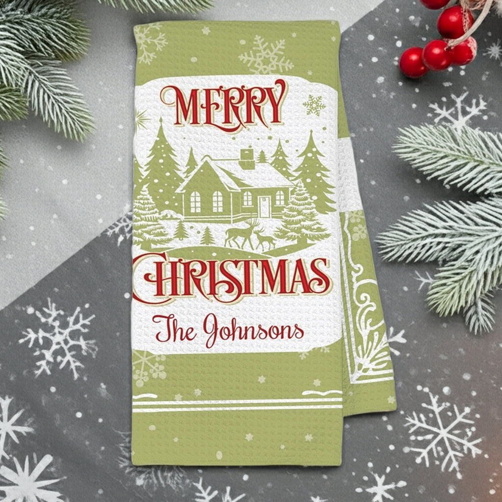 Personalized Christmas micro fiber kitchen towel featuring a festive design with snow-covered house and custom text The Johnsons