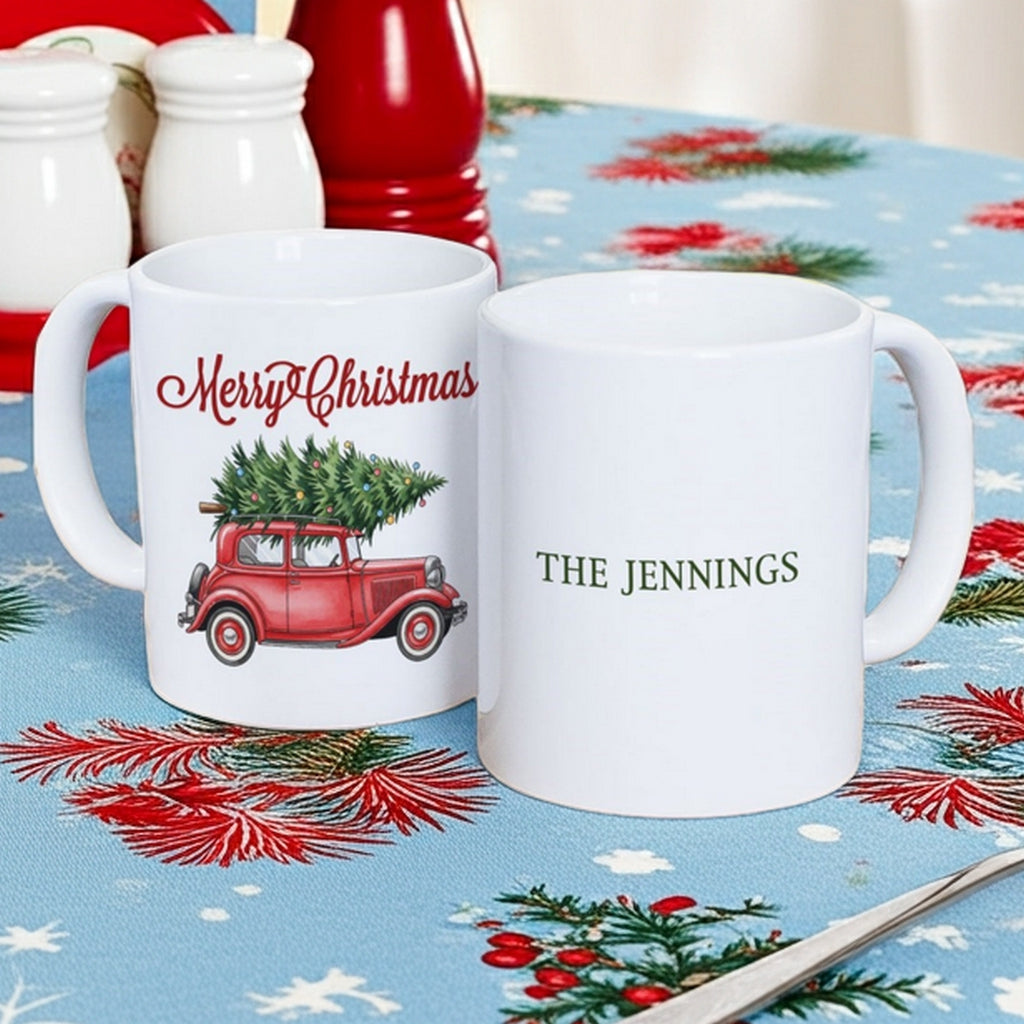 Personalized Christmas mug featuring a red truck with a Christmas tree and custom name option