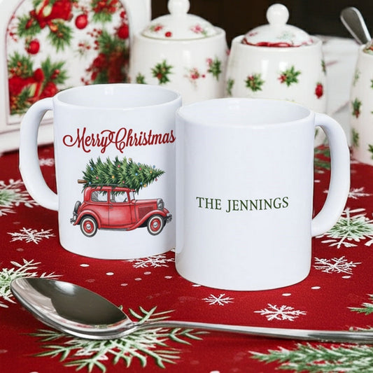 Personalized Christmas mug featuring a vintage car with a Christmas tree and custom family name