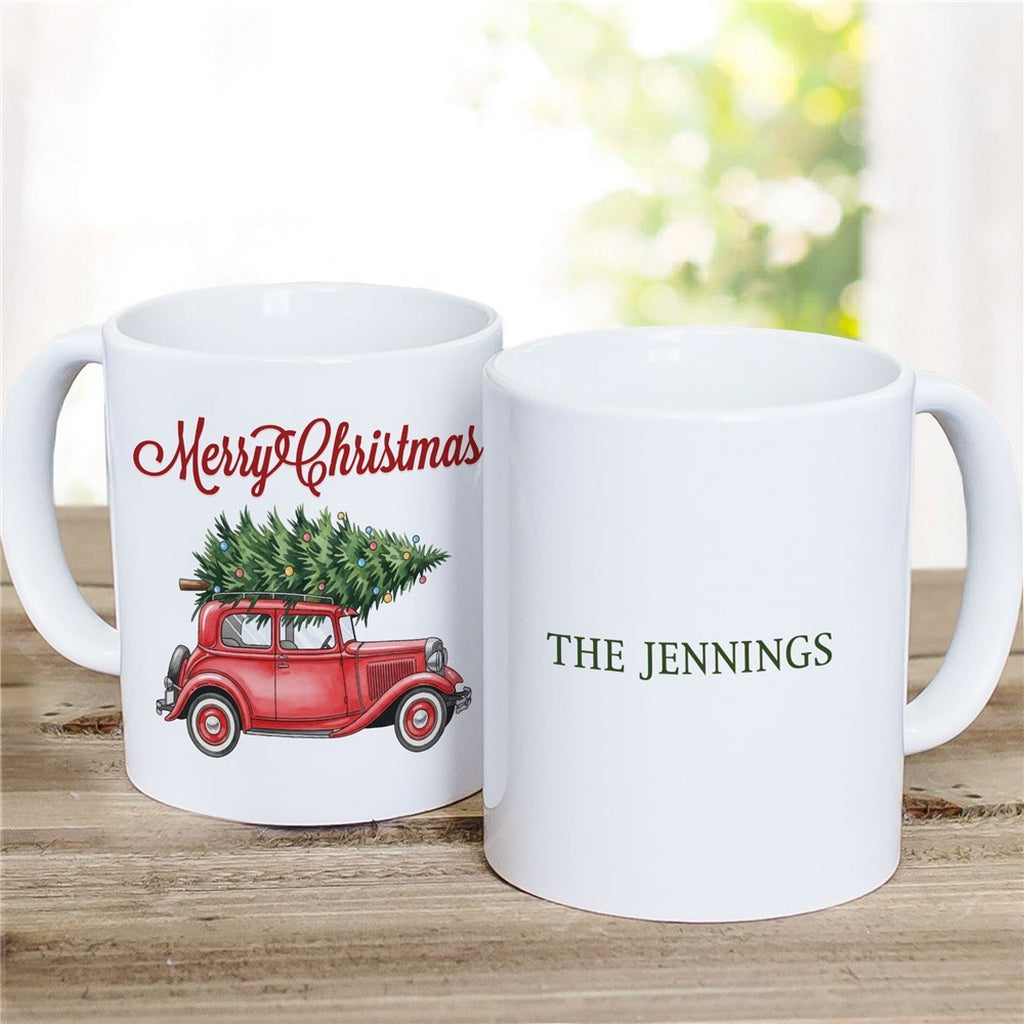 Personalized Christmas mug featuring a vintage red car with a Christmas tree and custom family name