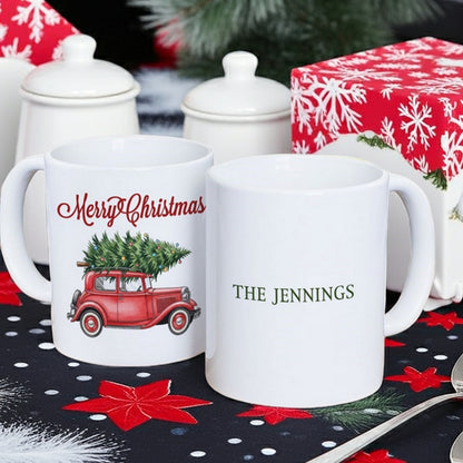 Personalized Christmas mug featuring a red truck with a Christmas tree and custom name 'The Jennings'