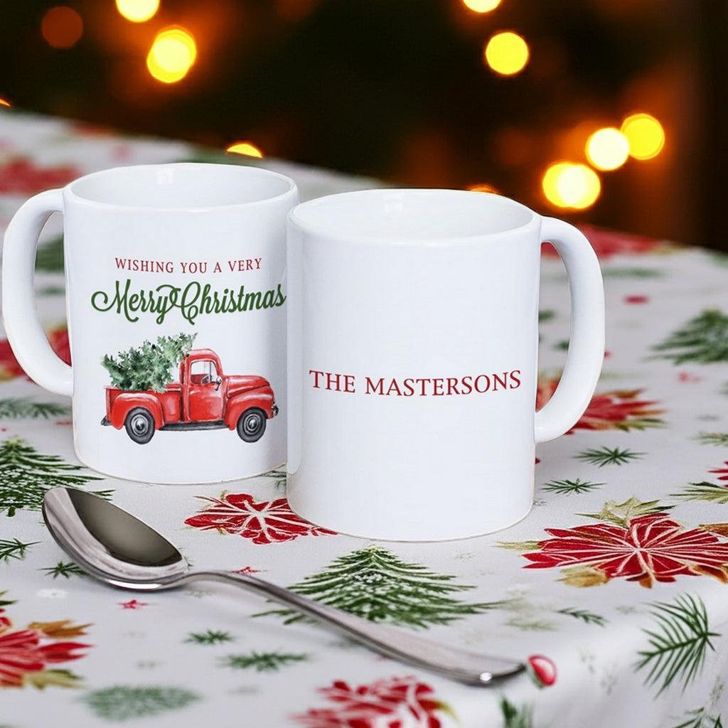 Two personalized Christmas mugs featuring festive designs and custom names for holiday gatherings