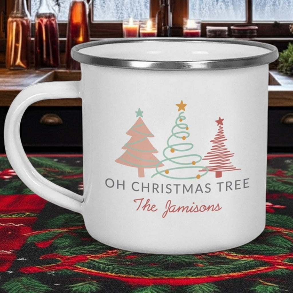 Personalized enamel Christmas mug featuring holiday trees and the name The Jamisons