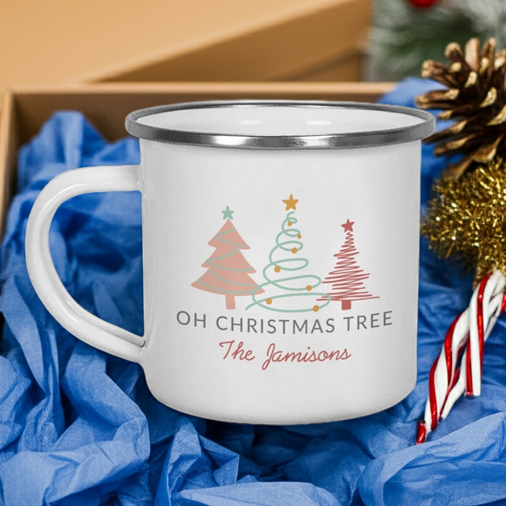 Personalized enamel Christmas mug featuring holiday design with trees and the name The Jamisons