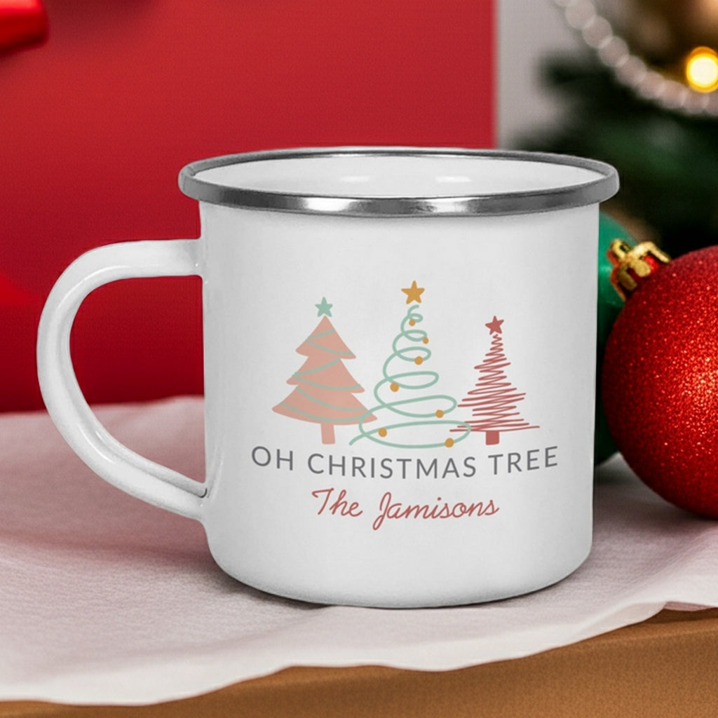 Personalized enamel Christmas mug featuring holiday tree designs and the name The Jamisons