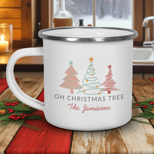 Personalized enamel Christmas mug featuring Christmas tree designs and custom name