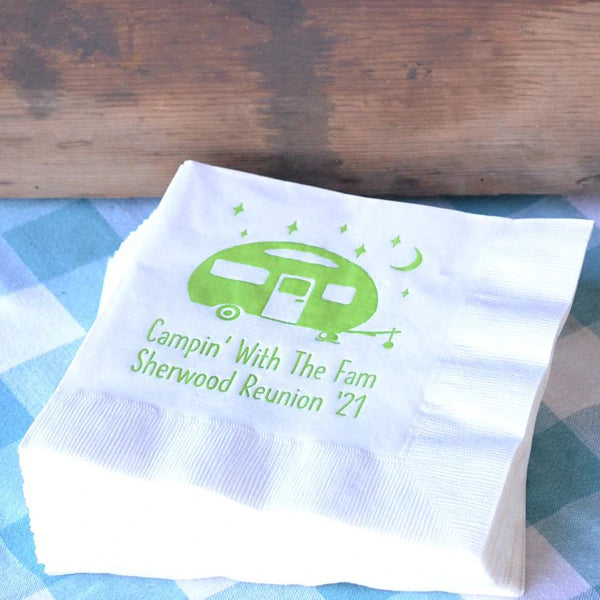 White family reunion lunch napkins personalized with camper design and 2 lines of text in neon green print on picnic table