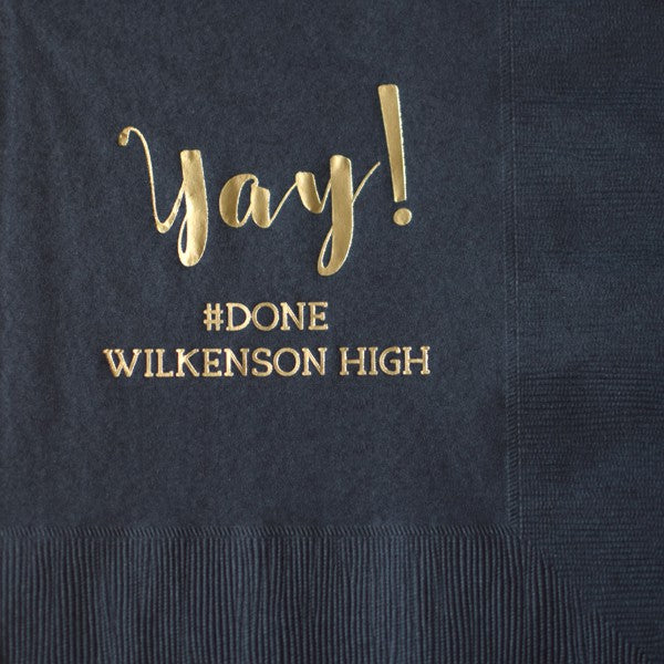 closeup of black 6 x 6 paper graduation luncheon napkins personalized with yay design and custom text in gold print