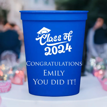 a blue 16 oz. stadium cup personalized with class of 2024 script design and 3 lines of custom text in white print