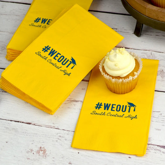 Yellow color paper graduation guest towels personalized with hashtag we out graduation design and graduate's high school name in hunter green print