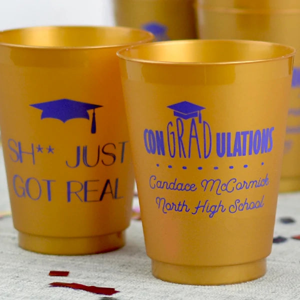 16 Oz. gold frosted graduation cups personalized with conGRADulations design and 3 lines of text on the front and SH Just Got Real design on back in Reflex blue print