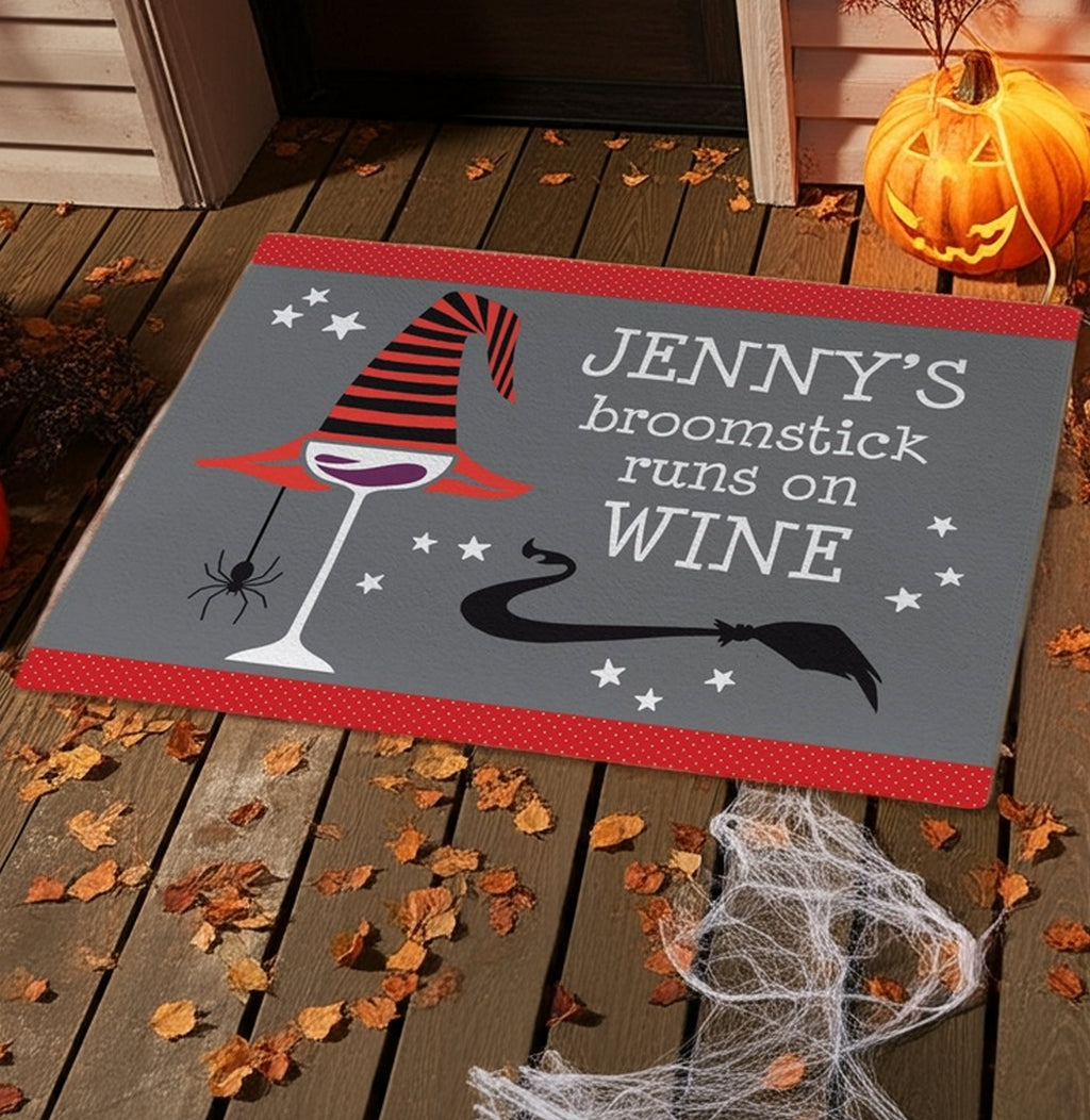 Personalized halloween doormat with witch hat, wine glass, spider, and broomstick design on porch
