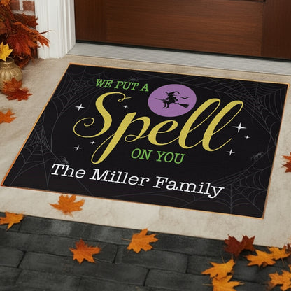 Personalized halloween doormat with spooky witch and family name design