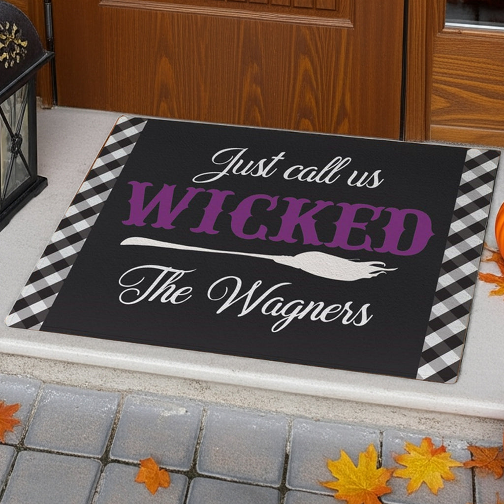 Personalized halloween doormat with wicked text and witch broom design